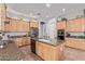 Spacious kitchen with wood cabinets, granite countertops and stainless steel appliances at 5215 S Monte Vista St, Chandler, AZ 85249