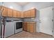 Functional laundry room with a washer, dryer, utility sink, and storage cabinets at 5215 S Monte Vista St, Chandler, AZ 85249
