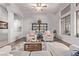 Bright living room featuring hardwood floors, a ceiling fan, and modern furniture, creating an inviting space at 5215 S Monte Vista St, Chandler, AZ 85249