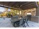 Outdoor kitchen featuring a built-in grill, counter space, dining table, and pergola, perfect for entertaining at 5215 S Monte Vista St, Chandler, AZ 85249