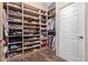 Large walk-in closet featuring custom wood shelving for ample storage at 5215 S Monte Vista St, Chandler, AZ 85249