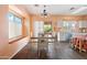 Charming dining area featuring tile floors, white chairs, natural light, and a view to the patio at 5622 E Emerald Cir, Mesa, AZ 85206