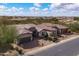 Spacious home with a three-car garage and desert landscaping, nestled in a community with mountain views at 5723 E Jake Hvn, Cave Creek, AZ 85331