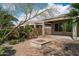 Inviting backyard featuring a charming fire pit and meticulously designed desert landscaping at 5723 E Jake Hvn, Cave Creek, AZ 85331