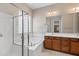 Bathroom featuring a glass shower, soaking tub, and a double sink vanity at 5723 E Jake Hvn, Cave Creek, AZ 85331