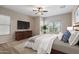 Serene bedroom featuring a ceiling fan, dresser, and cozy rug, creating a relaxing retreat at 5723 E Jake Hvn, Cave Creek, AZ 85331