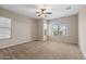 Spacious carpeted bedroom with a ceiling fan, recessed lighting, and multiple windows at 5723 E Jake Hvn, Cave Creek, AZ 85331
