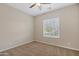 Bedroom with carpet, ceiling fan, and a bright window at 5723 E Jake Hvn, Cave Creek, AZ 85331