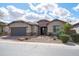 Charming one-story home with desert landscaping, a two-car garage, and a welcoming entrance at 5723 E Jake Hvn, Cave Creek, AZ 85331