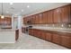 Expansive kitchen featuring granite countertops, stainless steel oven, and patterned backsplash at 5723 E Jake Hvn, Cave Creek, AZ 85331