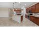 Bright, open kitchen with a granite island, stainless steel appliances, and modern lighting at 5723 E Jake Hvn, Cave Creek, AZ 85331