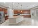 Spacious kitchen with granite island, stainless steel fridge, and ample cabinetry at 5723 E Jake Hvn, Cave Creek, AZ 85331
