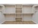 Walk-in closet featuring shelving for organization and carpeted floors at 5723 E Jake Hvn, Cave Creek, AZ 85331