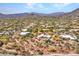 Desert home with a pool on a large private lot featuring a red outline and mountain views at 5805 E Agave Pl, Carefree, AZ 85377