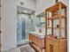 Modern bathroom featuring glass enclosed shower, wood vanity, and stylish fixtures at 5805 E Agave Pl, Carefree, AZ 85377