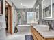 Bright bathroom with soaker tub, double sink vanity and stylish lighting fixtures at 5805 E Agave Pl, Carefree, AZ 85377