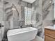 Beautiful bathroom features a large white tub, unique lighting, and modern vanity at 5805 E Agave Pl, Carefree, AZ 85377