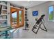 Bedroom features access to the outdoors through French doors and custom built-in shelving at 5805 E Agave Pl, Carefree, AZ 85377
