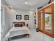Comfortable bedroom with white walls, neutral decor, and a view to the exterior at 5805 E Agave Pl, Carefree, AZ 85377