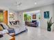 Bright bedroom featuring modern decor, a cozy seating area with fireplace, and large windows at 5805 E Agave Pl, Carefree, AZ 85377