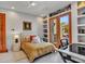 Sunlit bedroom with built-in storage and a view of the outdoor space at 5805 E Agave Pl, Carefree, AZ 85377