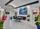 Well-lit dining area with large windows, modern furnishings, and eye-catching art at 5805 E Agave Pl, Carefree, AZ 85377