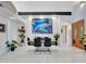 Dining room boasts modern style, striking artwork, and elegant natural light at 5805 E Agave Pl, Carefree, AZ 85377