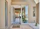 Front door interior showcasing modern door design with view into the home at 5805 E Agave Pl, Carefree, AZ 85377
