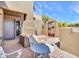 Front patio with table and chairs and view of the front entrance of the property at 5805 E Agave Pl, Carefree, AZ 85377
