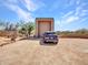 View of the garage and driveway showcasing parking space and desert landscaping at 5805 E Agave Pl, Carefree, AZ 85377