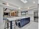 Spacious kitchen with large island, bar seating, and modern appliances beneath a skylight at 5805 E Agave Pl, Carefree, AZ 85377