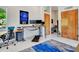Home office features standing desks, natural light, and ample storage space at 5805 E Agave Pl, Carefree, AZ 85377
