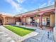 Expansive outdoor living space features covered patio, manicured lawn, and gravel accents at 5805 E Agave Pl, Carefree, AZ 85377