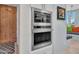Modern, built-in oven and microwave combo, with a view of the breakfast nook nearby at 5805 E Agave Pl, Carefree, AZ 85377