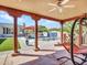 Covered patio provides views of the pool and lush landscaping at 5805 E Agave Pl, Carefree, AZ 85377
