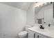 Modern bathroom featuring a toilet, vanity with a sink and a large mirror at 6312 W Villa Linda Dr, Glendale, AZ 85310