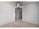 Neutral bedroom featuring a ceiling fan and a walk-in closet at 6312 W Villa Linda Dr, Glendale, AZ 85310