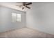 Comfortable bedroom bathed in natural light, complete with ceiling fan at 6312 W Villa Linda Dr, Glendale, AZ 85310