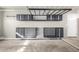 Well-organized garage space with workbench and storage cabinets at 6312 W Villa Linda Dr, Glendale, AZ 85310