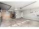 Spacious garage with ample storage shelves and epoxy flooring at 6312 W Villa Linda Dr, Glendale, AZ 85310