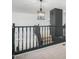 A carpeted staircase and black railing lead to an upper level of the home, adorned with modern lighting at 6312 W Villa Linda Dr, Glendale, AZ 85310