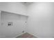 An empty storage room has a wall-mounted shelf and ample space for organizing and storing your belongings at 6312 W Villa Linda Dr, Glendale, AZ 85310
