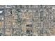 An aerial view displaying a residential neighborhood with the subject property marked in red among the surrounding homes and streets at 6408 S 10Th St, Phoenix, AZ 85042