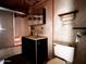 Bathroom with a combination shower and tub, a pedestal sink, mirrored medicine cabinet, and a standard toilet at 6408 S 10Th St, Phoenix, AZ 85042