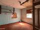 Bedroom with peeling wallpaper and damage throughout needing a full remodel to modernize at 6408 S 10Th St, Phoenix, AZ 85042