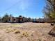 Extensive gravel front yard needing care, leading to a modest, single-story home at 6408 S 10Th St, Phoenix, AZ 85042