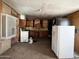 Dated kitchen featuring vintage appliances and needing a full renovation and upgrade at 6408 S 10Th St, Phoenix, AZ 85042