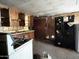 Vintage kitchen features a stove, wood cabinets, and outdated appliances needing renovation at 6408 S 10Th St, Phoenix, AZ 85042