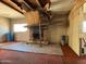 Living room with stone fireplace, showing damage requiring thorough restoration at 6408 S 10Th St, Phoenix, AZ 85042