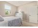 Bedroom view highlighting a window, neutral walls, soft carpet, and simple, charming decor at 7243 E Teal Way, San Tan Valley, AZ 85143